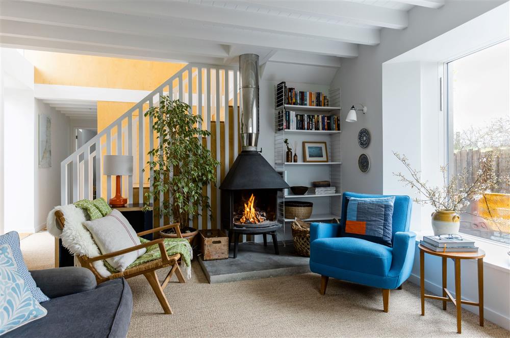 The cosy sitting room with a wood burning stove