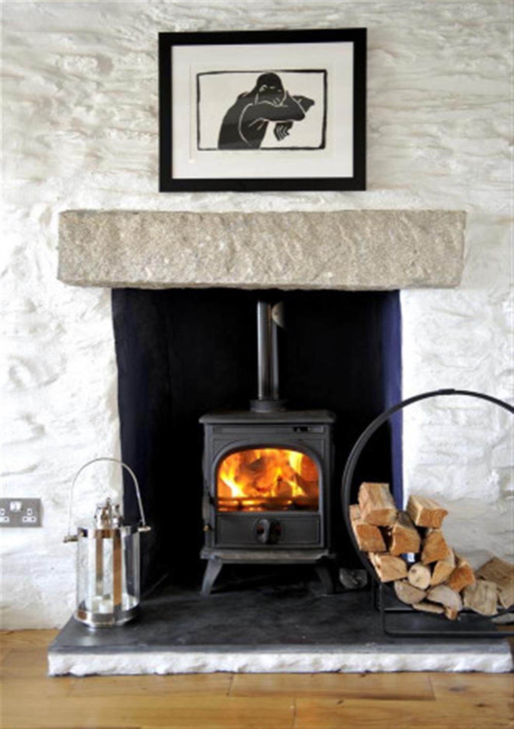 The cosy woodburner stove at The Cobbles in Polperro