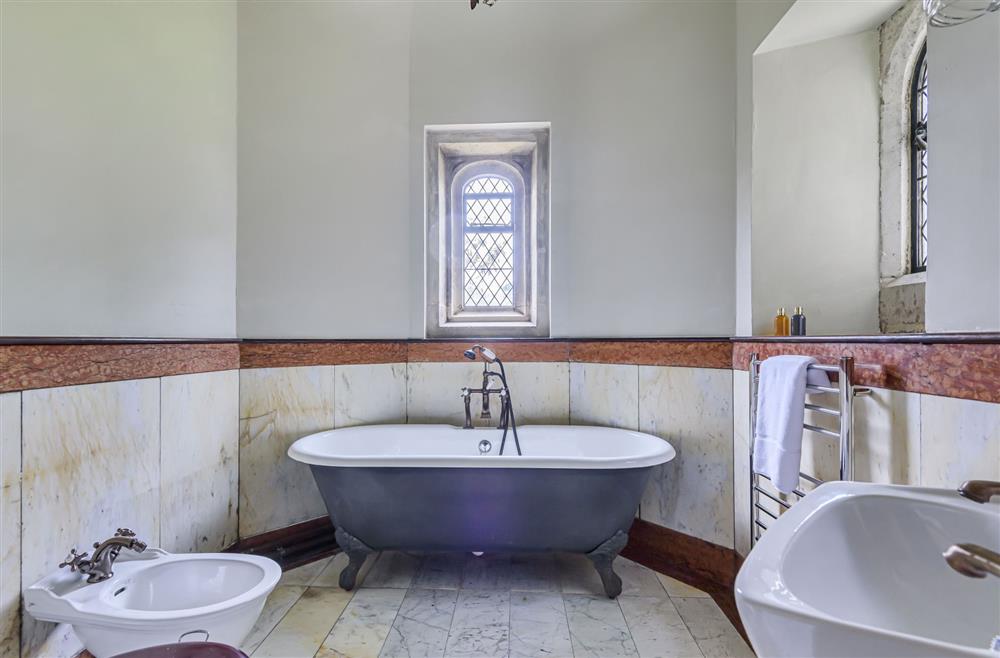 The en-suite bathroom to bedroom four with a roll-top bath at The Cochrane Wing, Dorchester