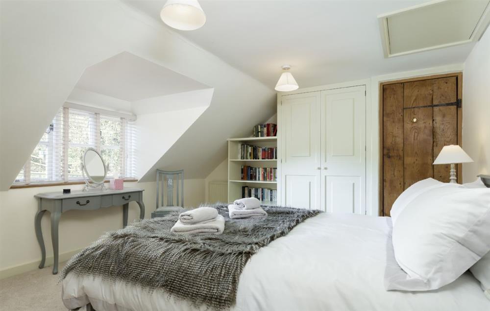 Double bedroom with king size 5’ bed and a dressing table at The Coppice, Ashton under Hill