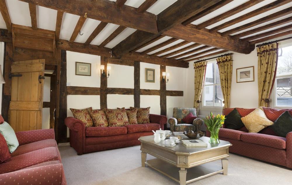 The spacious drawing room with exposed beams and open fire (photo 2) at The Coppice, Ashton under Hill