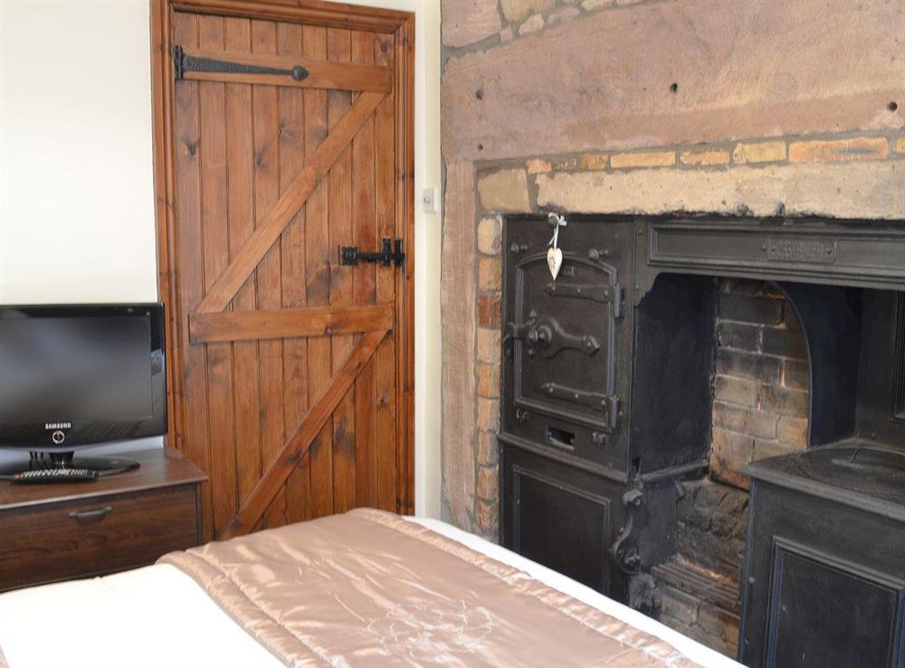 Double bedroom with plenty of character at The Coracle in Seahouses, Northumberland
