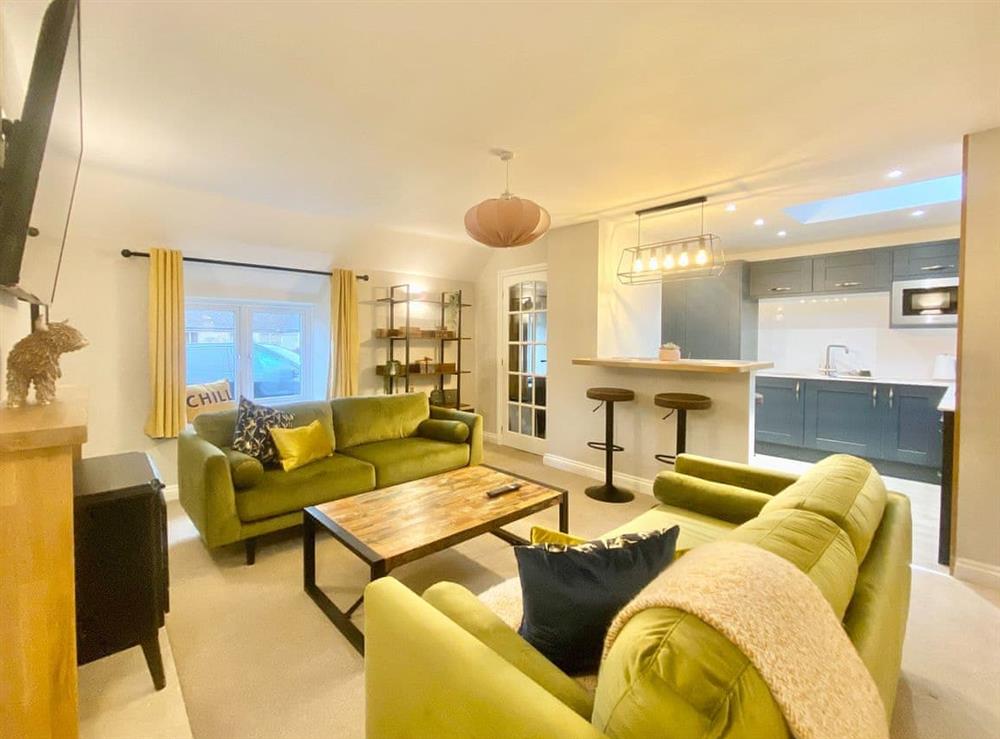 Open plan living space at The Corner Barn in Cirencester, Gloucestershire