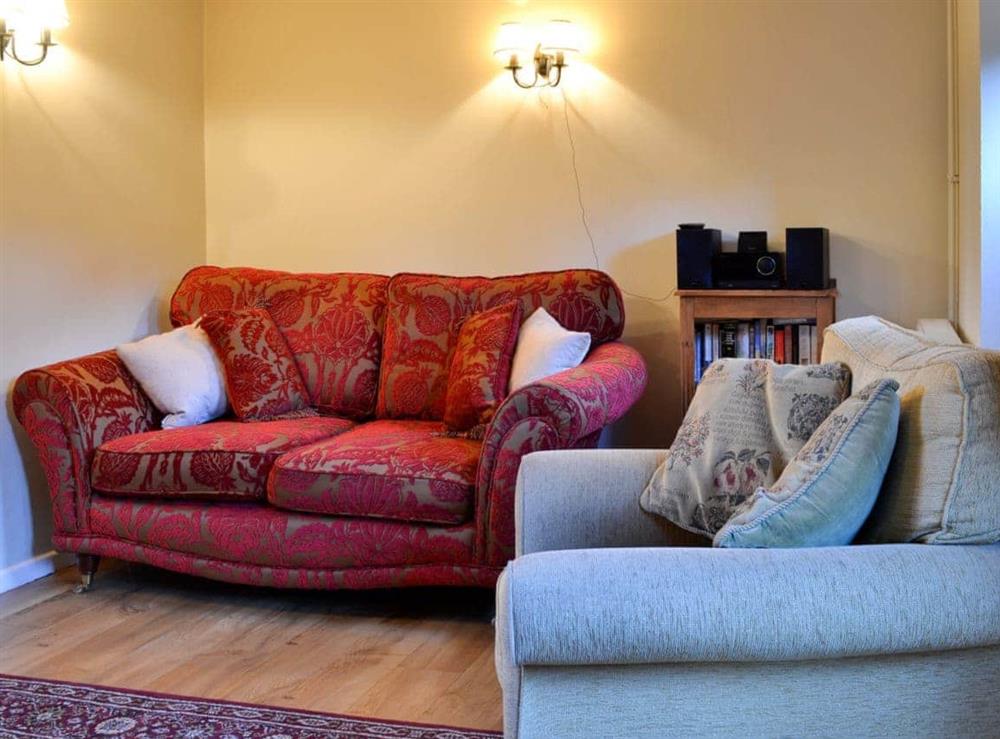 Comfortable furnishings in the living room at The Cot in Bussage, near Cirencester, Gloucestershire