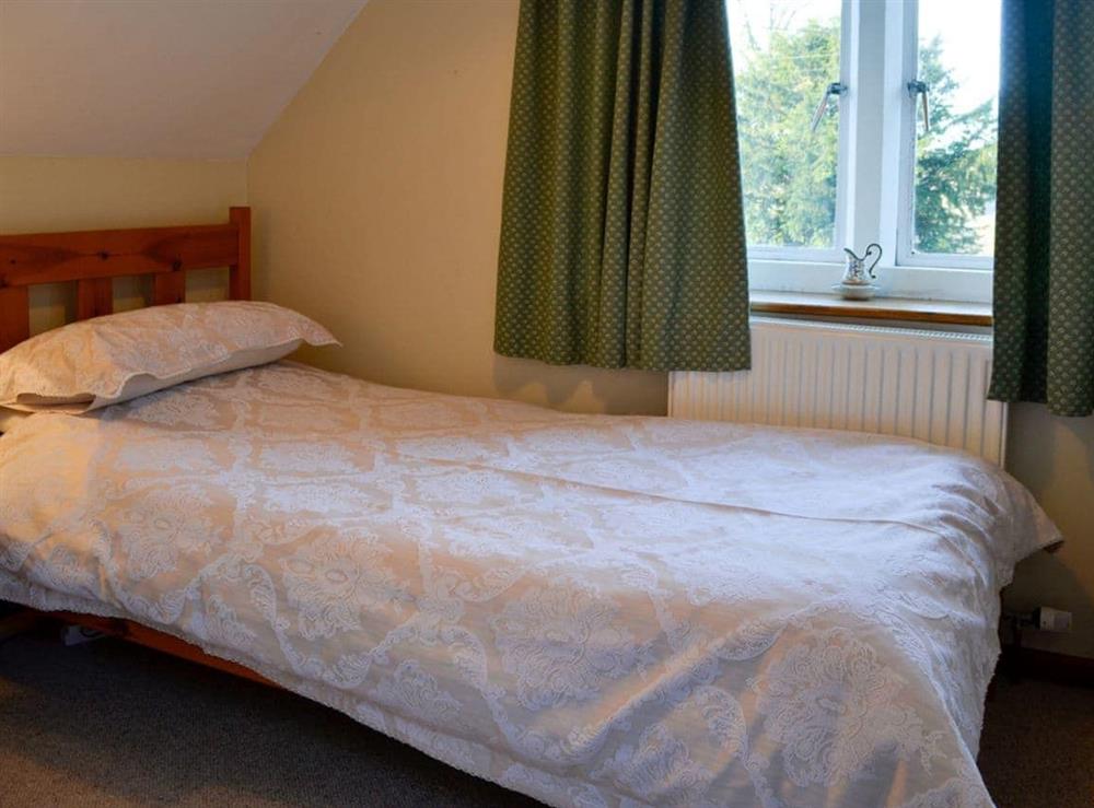 Modest single bedroom at The Cot in Bussage, near Cirencester, Gloucestershire