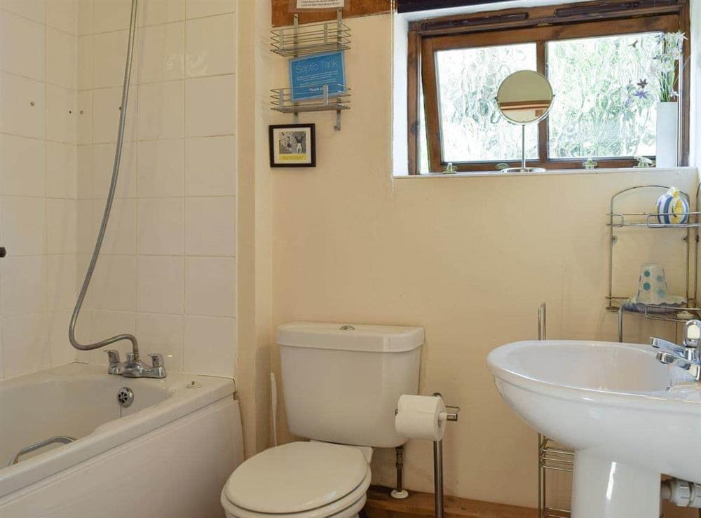 Family bathroom with shower over bath at The Cotes in Upper Welland, near Malvern, Worcestershire