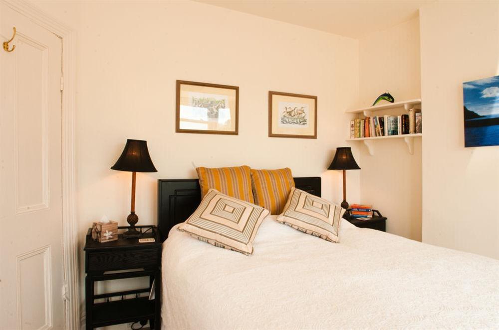 Master bedroom with King-size bed at The Cottage (13 Clarence hill) in 13 Clarence Hill, Dartmouth