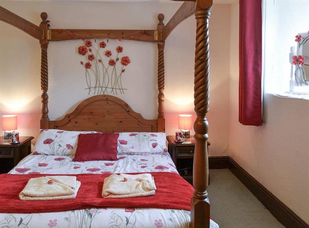 Four poster bedroom at The Cottage in Axminster, Devon