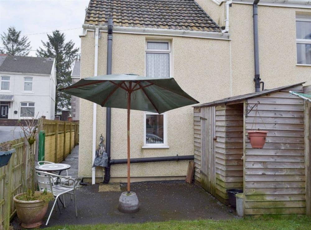 Patio area at rear of property at The Cottage in Cross Hands, near Carmarthen, Dyfed