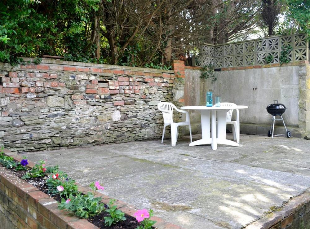Sitting out area with BBQ at The Cottage in Ilfracombe, Devon