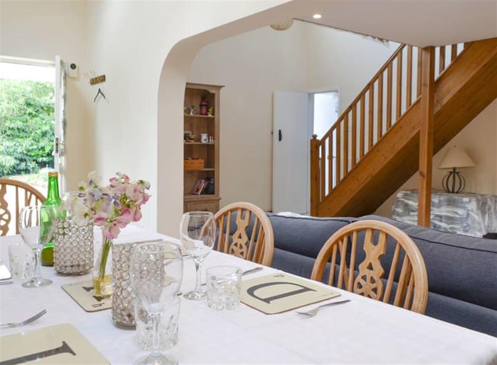 Light and airy dining space at The Cottage Island Heron in Wolverton Common, near Tadley, Hampshire