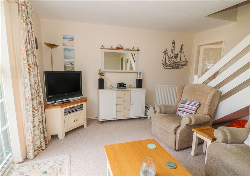 Relax in the living area at The Cottage On The Green, Porthmadog