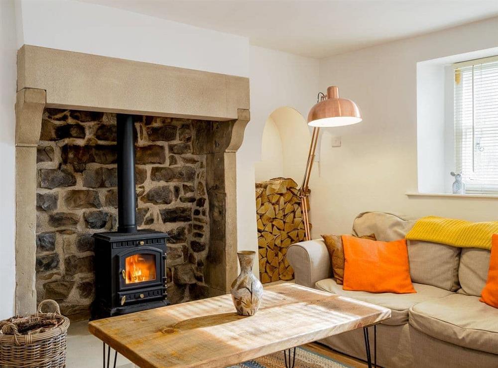 Warm and cosy living area with wood burner at The Cottage in Pateley Bridge, near Harrogate, North Yorkshire