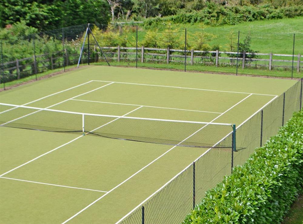 Tennis court at The Cottage in Prestbury, near Cheltenham, Gloucestershire