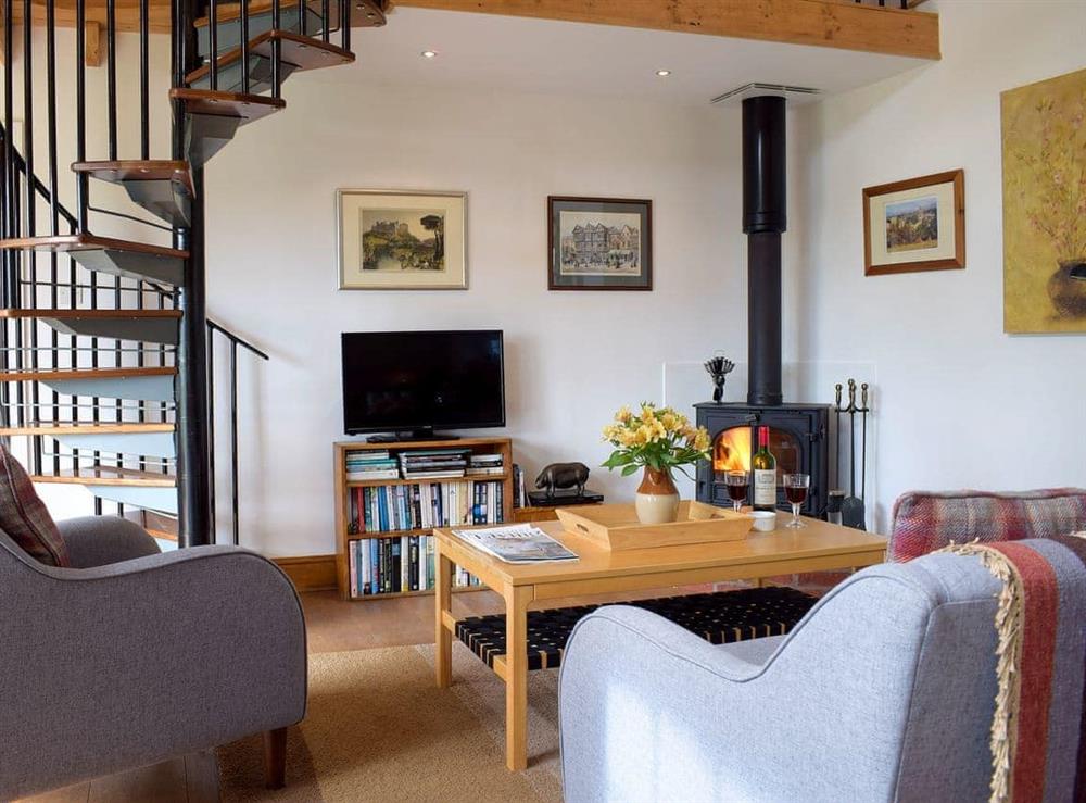 Cosy living area with wood burner at The Cottage in Richards Castle, near Ludlow, Shropshire