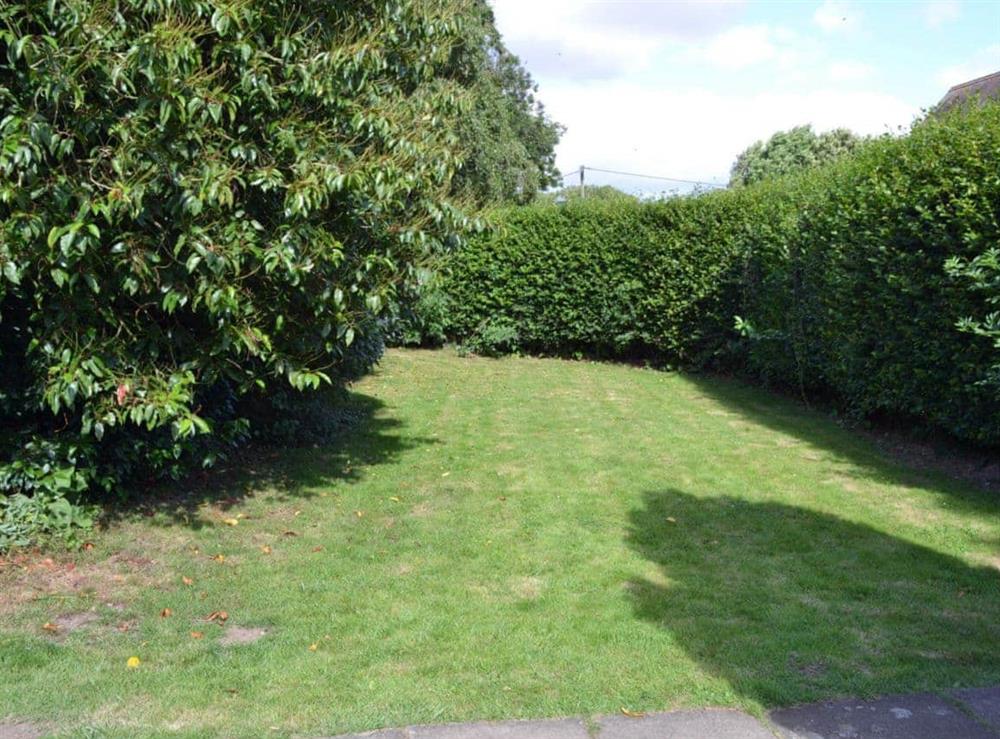 Lawned garden area at The Cottage in Scarning, near Dereham, Norfolk