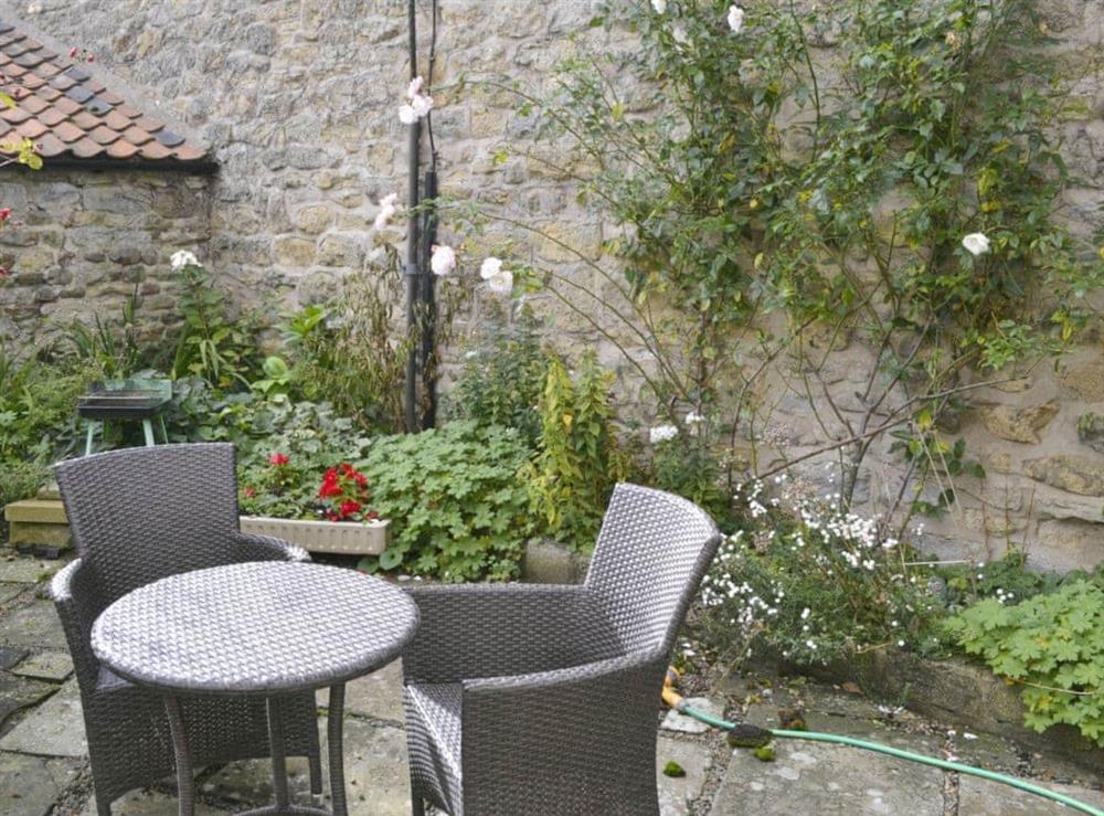 Garden furniture on paved patio area at The Cottage in Sinnington, near Pickering, North Yorkshire