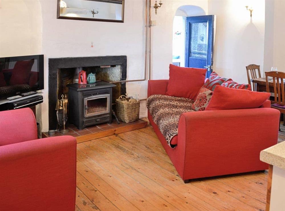 Living area with Multifuel fire at The Cottage in St. Cyrus, Montrose, Angus