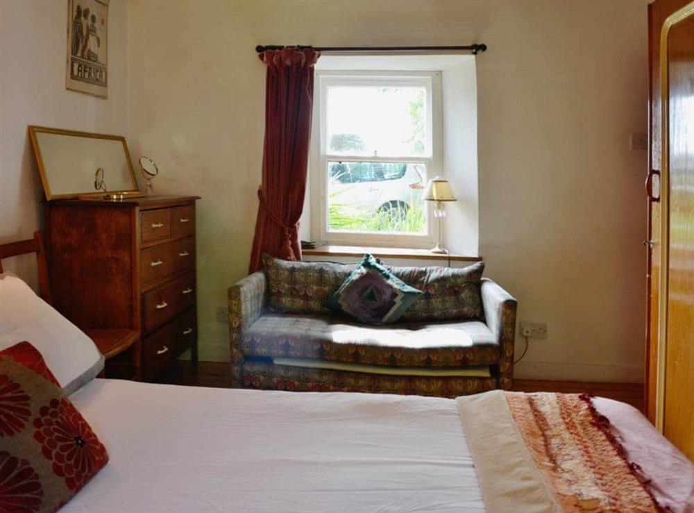 Romantic double bedroom with beamed ceiling at The Cottage in St. Cyrus, Montrose, Angus