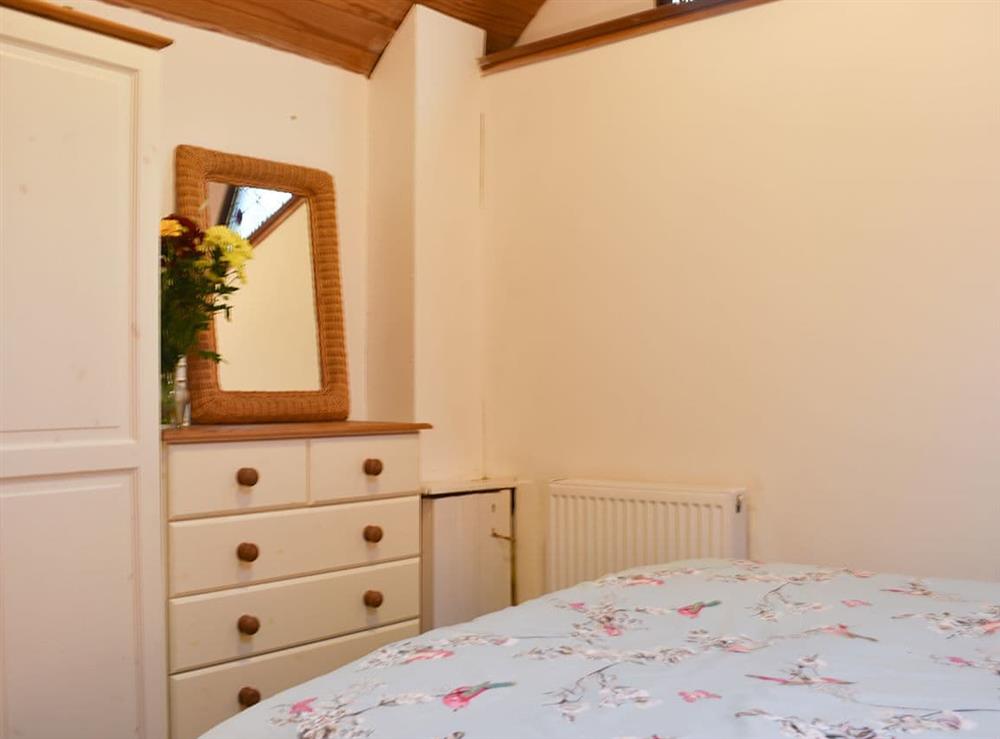 Lovely bedroom with ample storage at The Cottage By The Sea Annexe, 