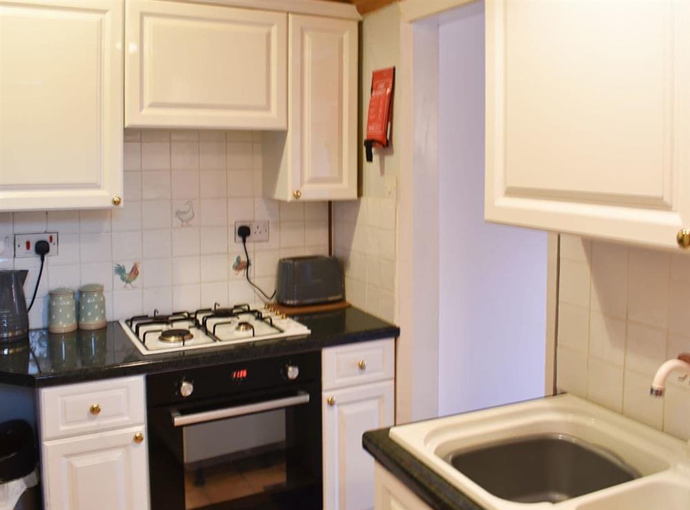 Well equipped kitchen at The Cottage By The Sea Annexe, 