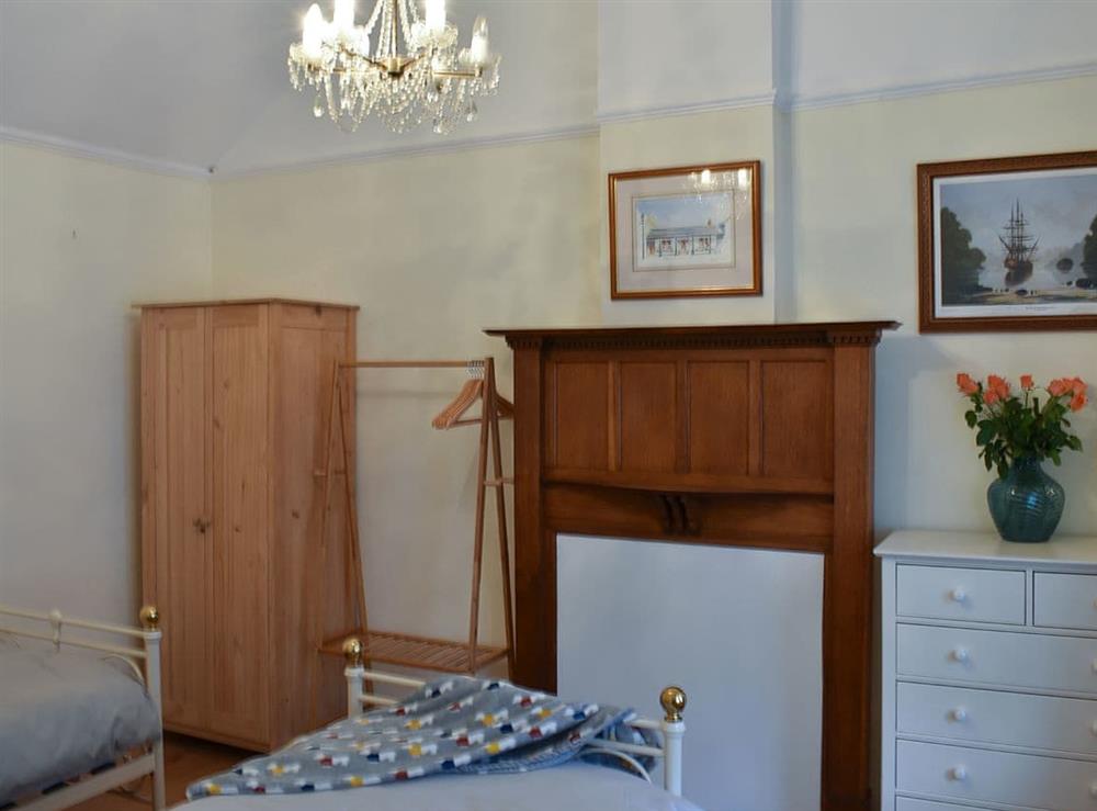 Lovely bedroom with twin single beds at The Cottage by the Sea, 