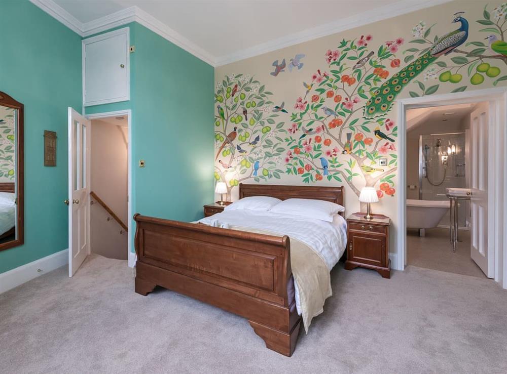 Double bedroom featuring hand painted mural at The Counting House in Wirksworth, near Matlock, Derbyshire