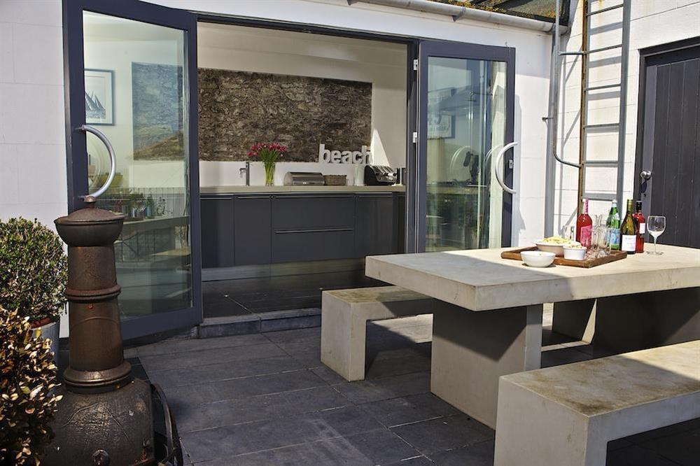 Terrace area extending out from the kitchen at The Court House in Buckley Street, Salcombe