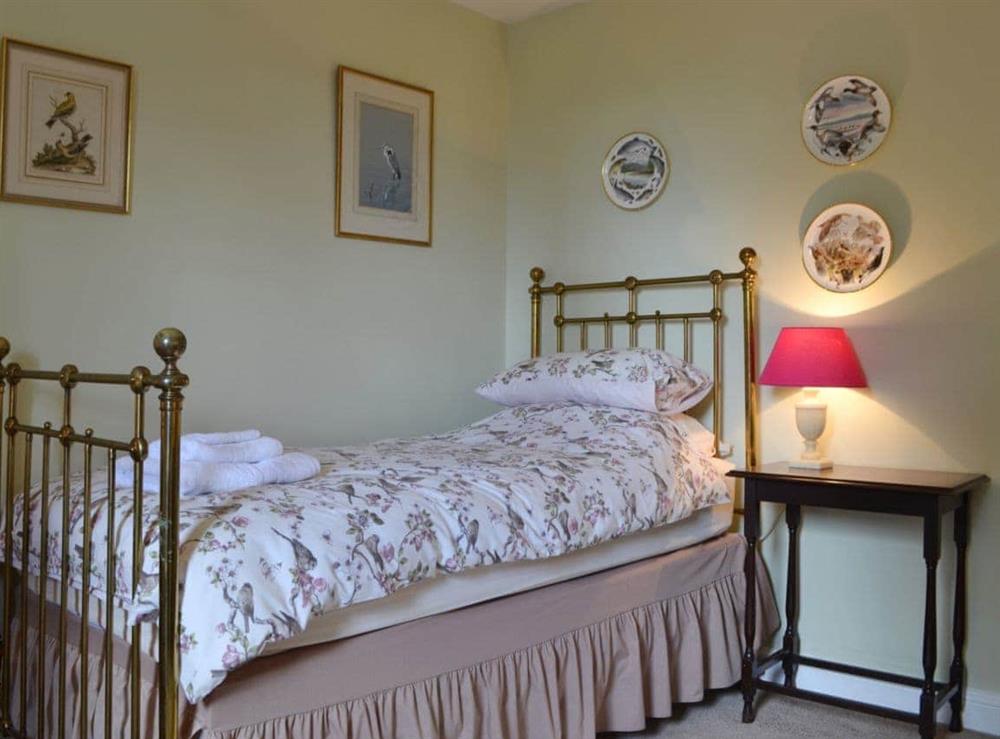 Single bedroom with antique style bed at The Court House in Nr Kirkby Lonsdale, Cumbria., Lancashire