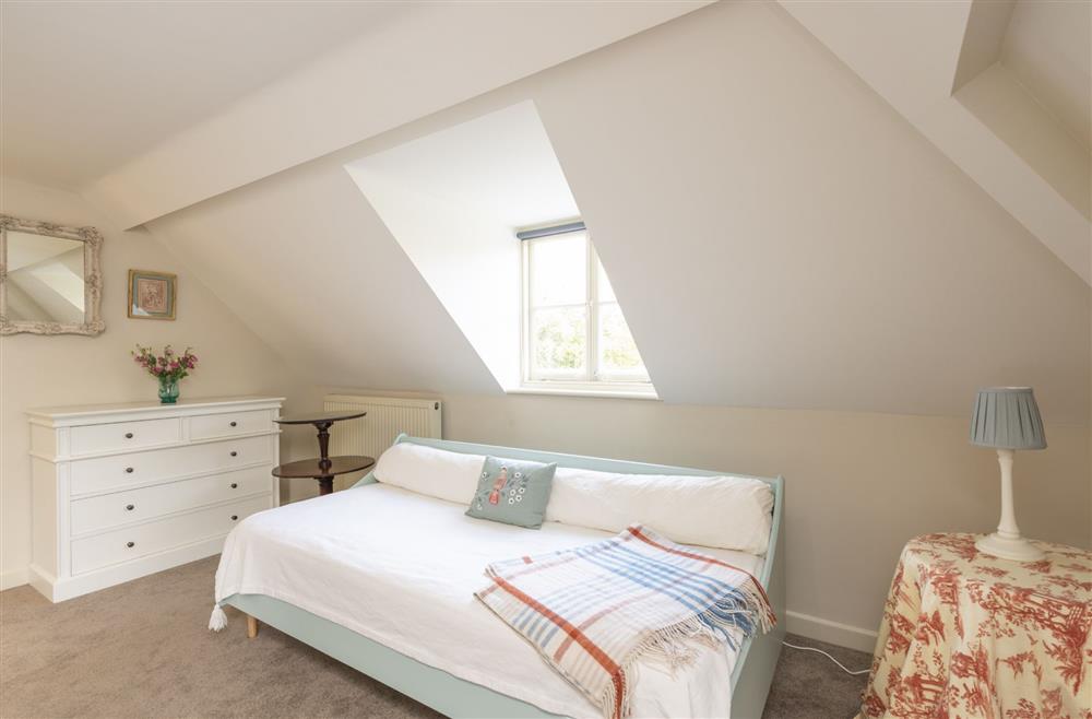 Bedroom four with two 3’ single beds and day bed at The Courtyard House, Winterborne Came
