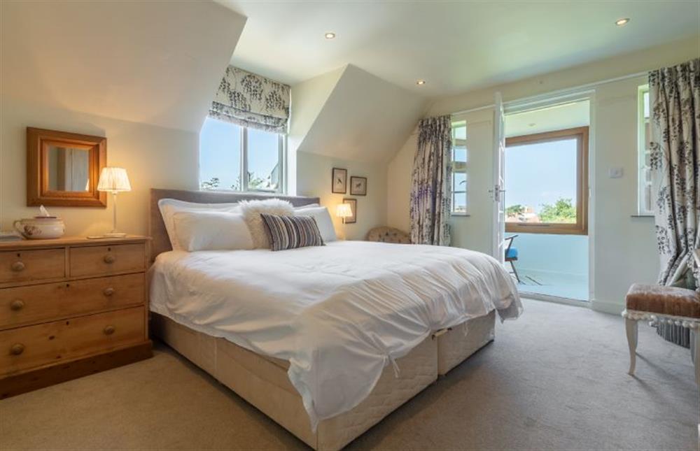 The Master bedroom opens onto the balcony at The Cove, Old Hunstanton