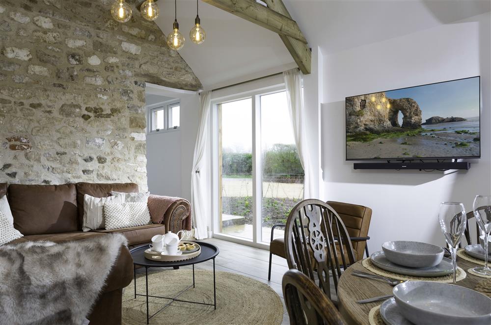 Exposed beams and stonework in the sitting area