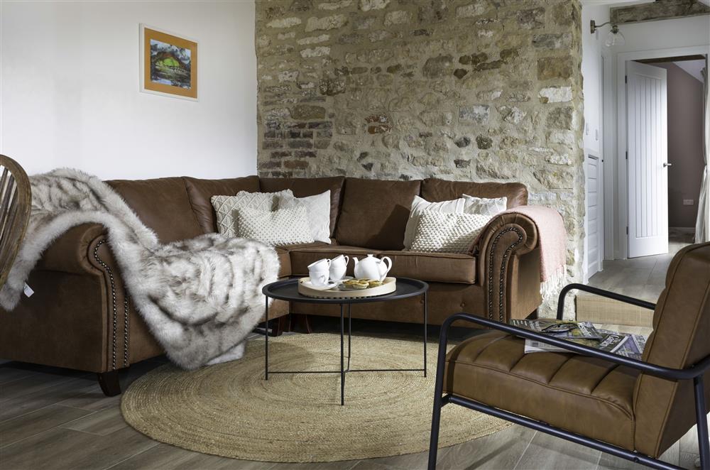 Sumptuous seating and exposed stonework in the sitting area