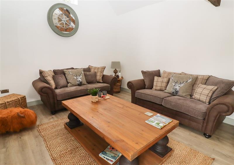 Enjoy the living room at The Cow Shed at Pear Tree Farm, Kirkhouse Green near Sykehouse