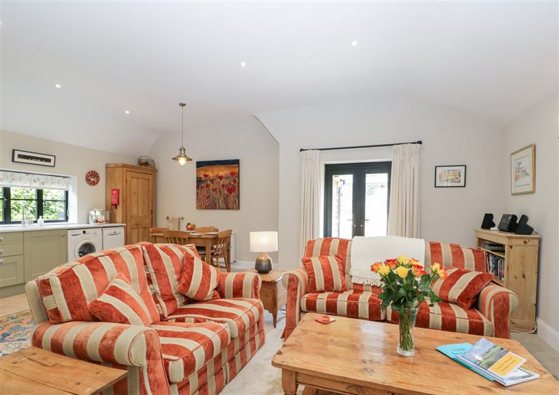 Relax in the living area at The Cow Shed, Frampton Mansell