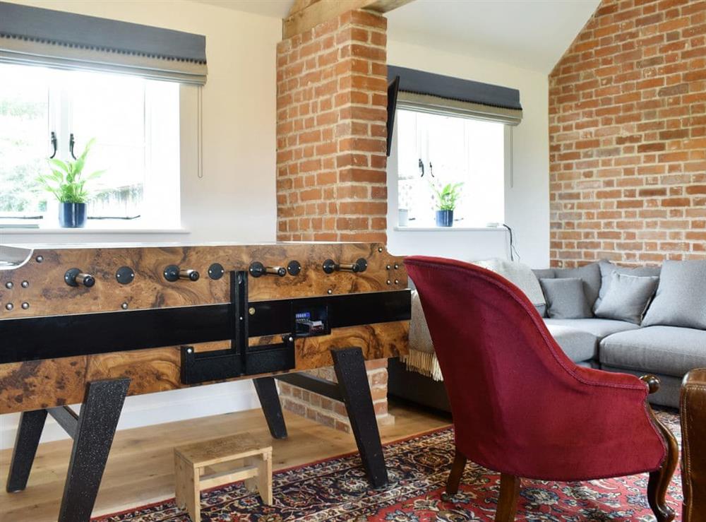 Entertaining table football within the open-plan living space