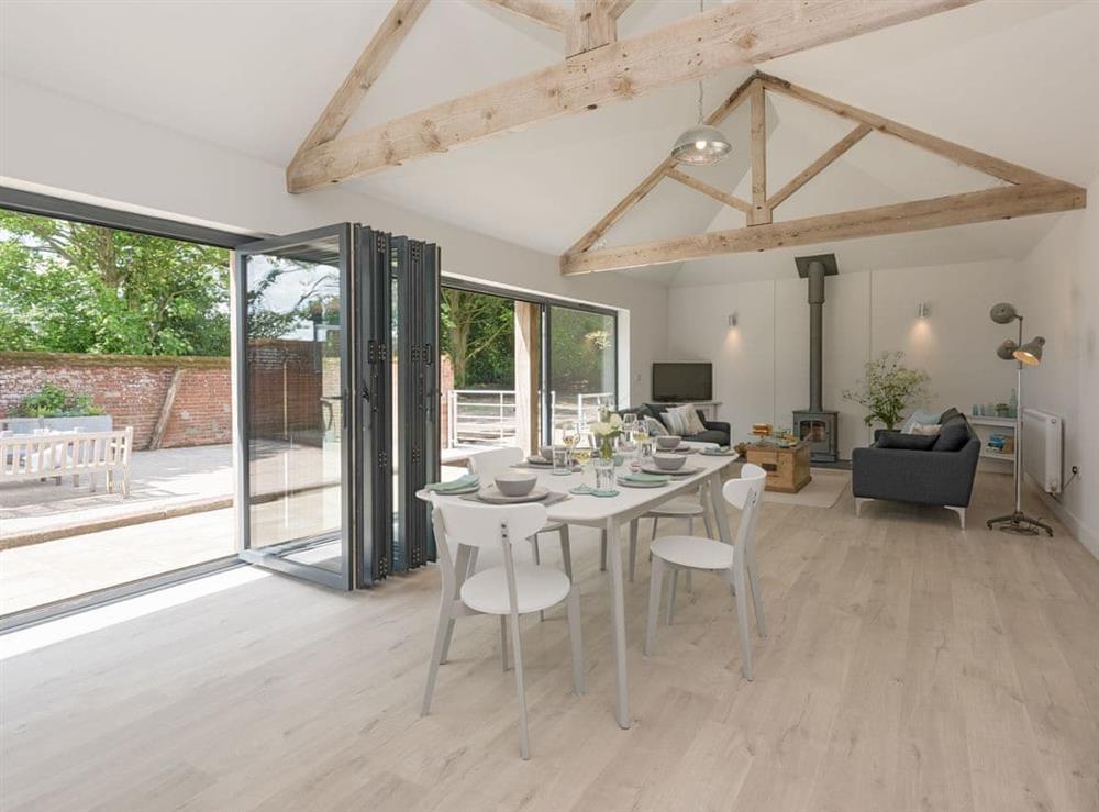 Spacious open-plan living space at The Cowshed in Reepham, Norfolk