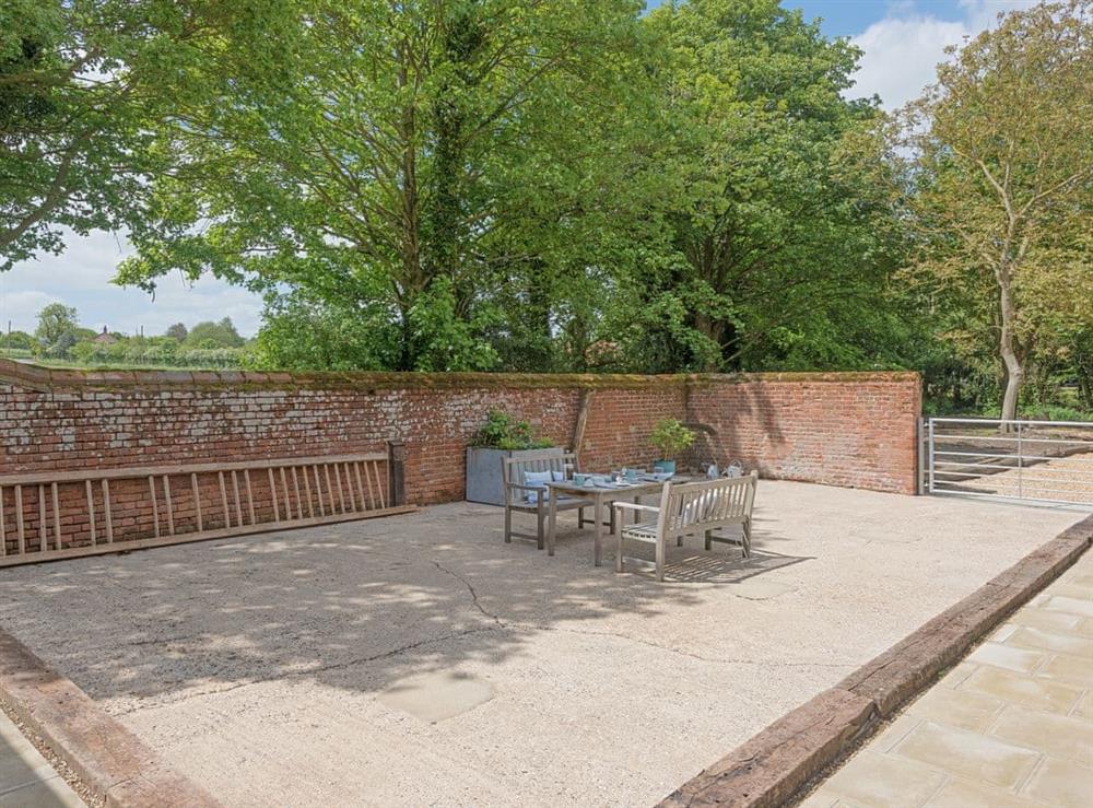 Spacious patio with high quality outdoor furniture at The Cowshed in Reepham, Norfolk