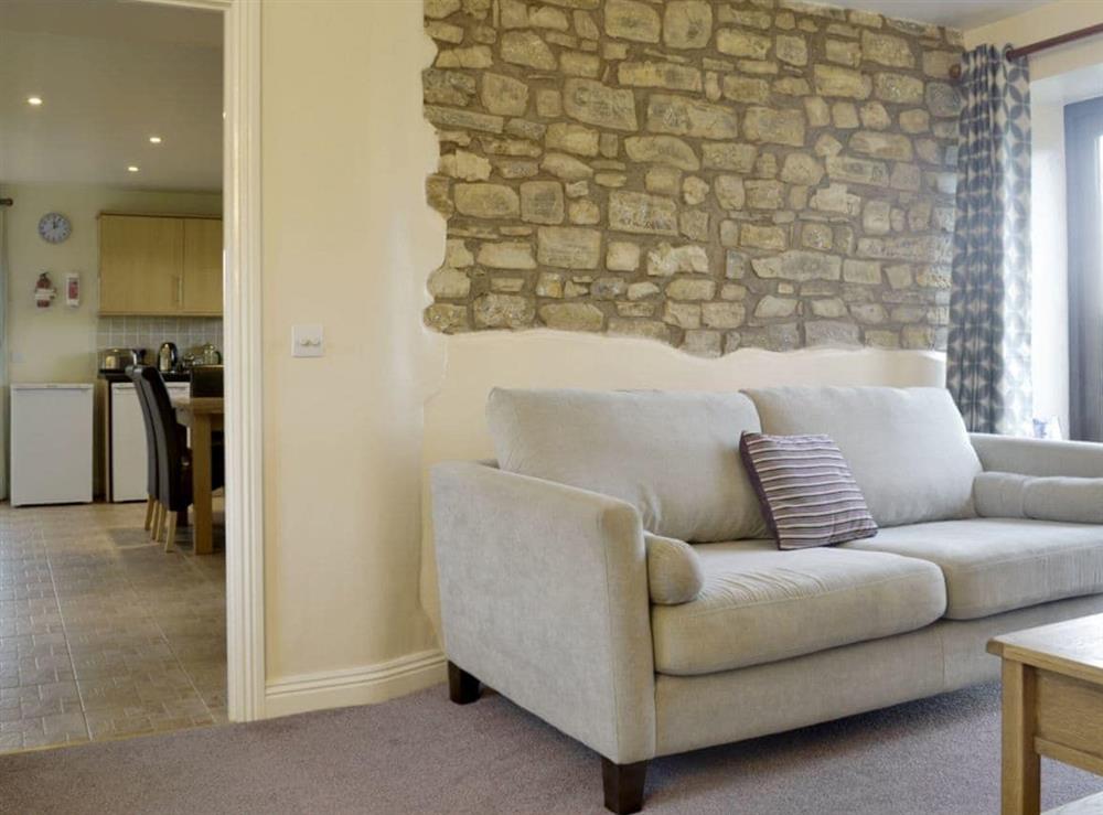 Living room is conveniently situated next to kitchen/diner at The Creamery in North Wootton, near Wells, Somerset