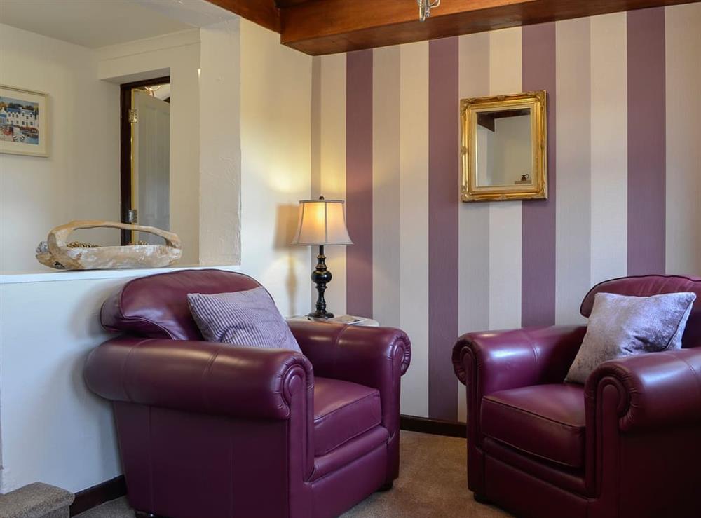 Comfortable seating area as part of the master bedroom at Penny Croft, 