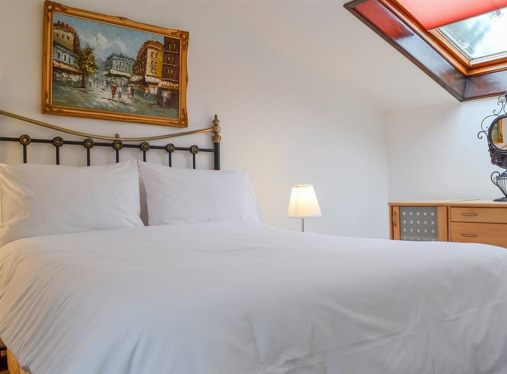 Double bedroom with antique style bed at Penny Croft, 