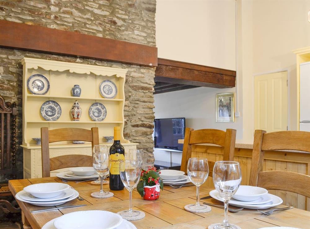 Exposed stone wall and traditional furniture in the kitchen/diner at Penny Croft, 