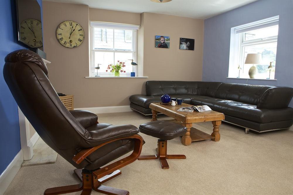 Bright open plan lounge with leather sofas at The Crows Nest in , Salcombe