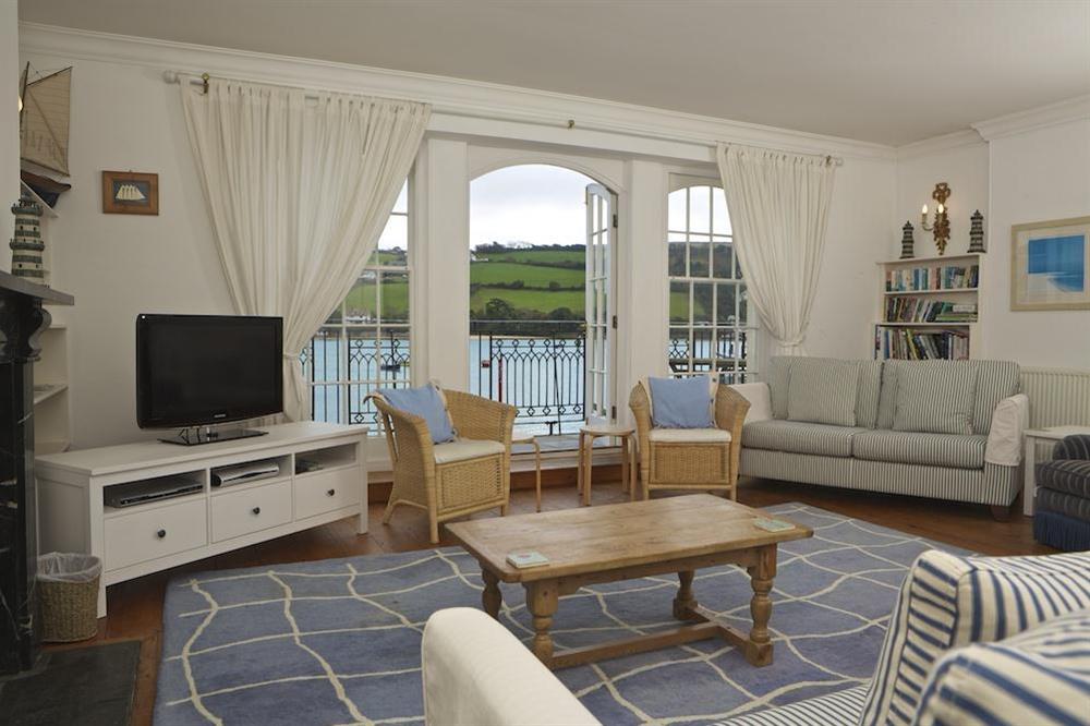 Lounge leads out to a magnificent balcony with panoramic views across towards East Portlemouth at The Custom House in Union Street, Salcombe