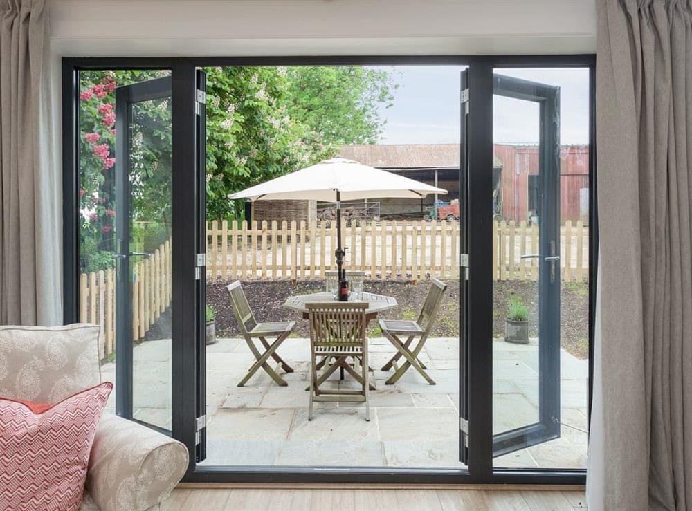 French door from living area to patio at The Dairy in Beauworth, near Alresford, Hampshire
