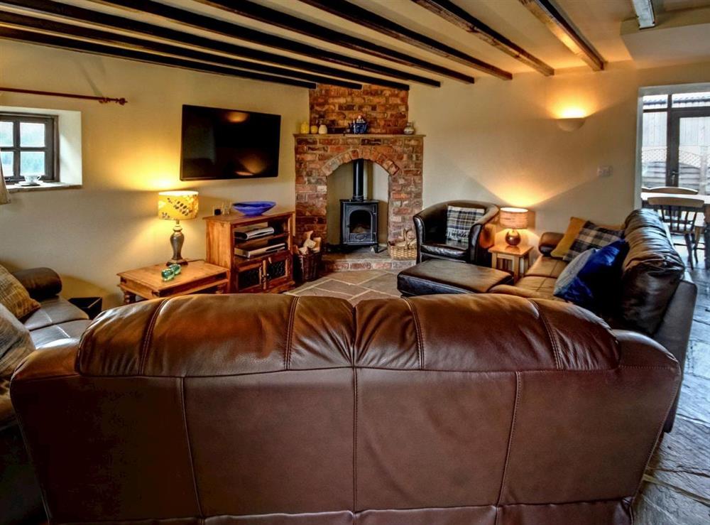 Spacious living room with wood-burner at The Dairy in Beck Hole, near Goathland, North Yorkshire