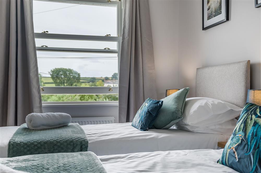 Admire the pretty views across the countryside from bedroom one at The Dairy, Braunton 