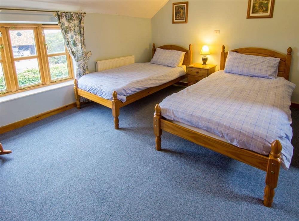 Comfortable twin bedroom at The Dairy in Coddington, Cheshire
