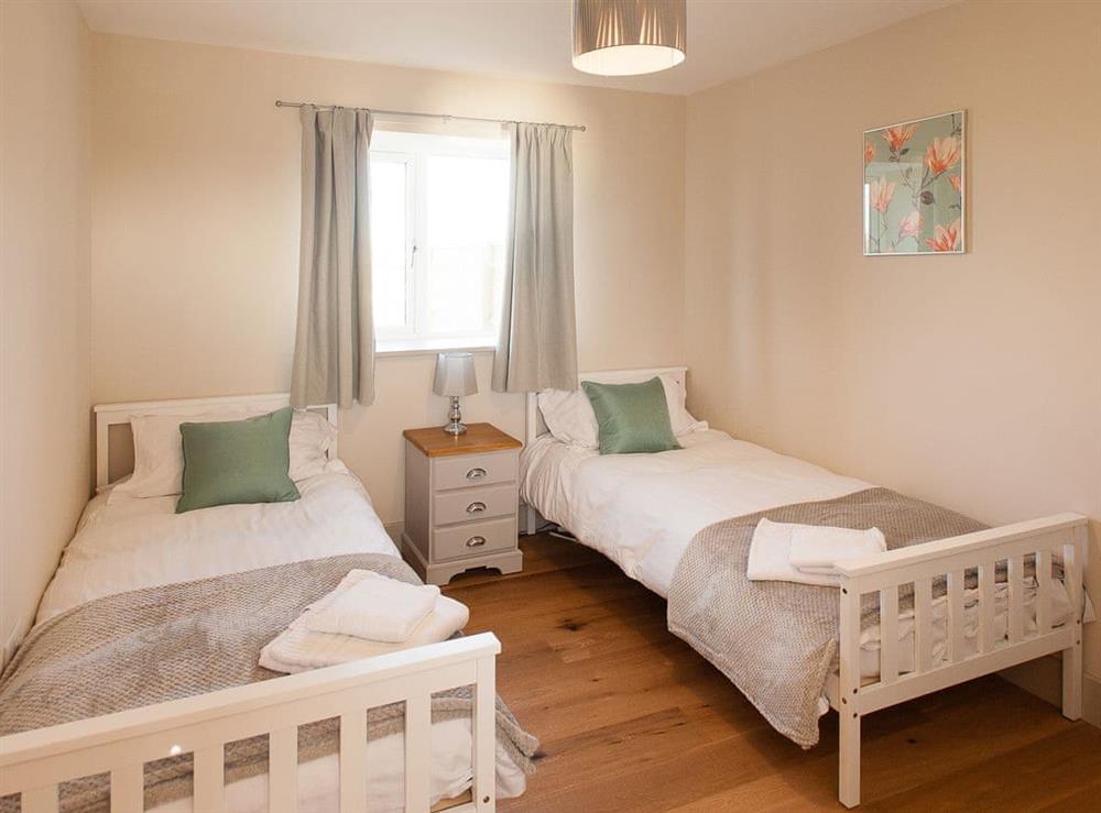 Twin bedroom at The Dairy in Cricklade, Wiltshire