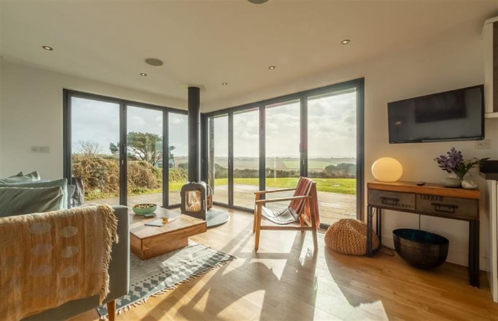 The Deck House, St Agnes. Light floods in the this stunning open plan living area at The Deck House, Chapel Porth, St Agnes